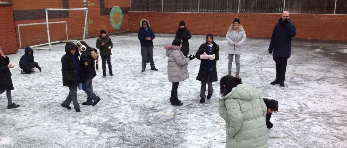 Key Stage 2 children enjoying the snow
